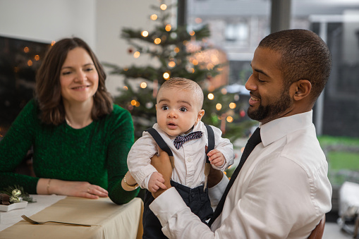 Christmas home for a diverse mixed race family and baby