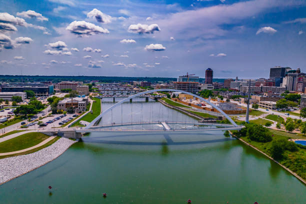 Aerial shot of the Iowa Women of Achievement Bridge in Downtown Des Moines, Iowa An aerial shot of the Iowa Women of Achievement Bridge across the Des Moines River in Downtown Des Moines, Iowa iowa stock pictures, royalty-free photos & images