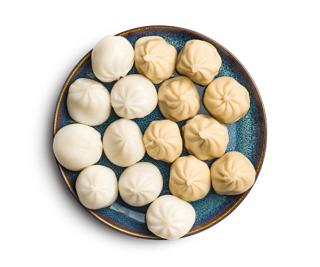 Xiaolongbao, traditional steamed dumplings on plate. Xiao Long Bao buns isolated on the white background.