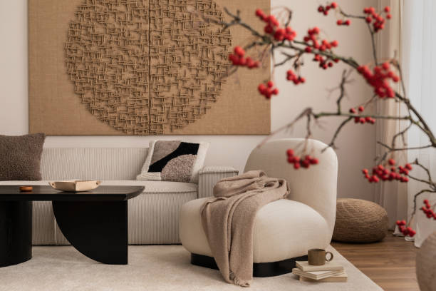 istock Creative composition of living room interior with mock up poster frame,  rounded shapes armchair, plaid, modular sofa, pillows, black coffee table and personal accessories. Home decor. Template. 1459596391