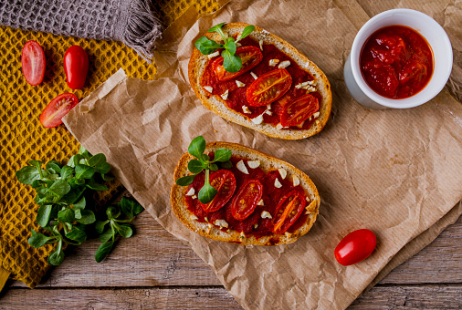 Delicious bruschetta made from homemade bread with cherry tomatoes, cheese and vegetables