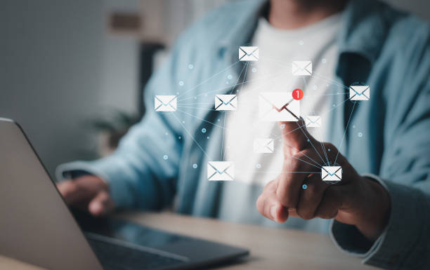 istock Marketing concept. Man using laptop pc with email icon. Direct selling project in customer list business for email. 1459602872