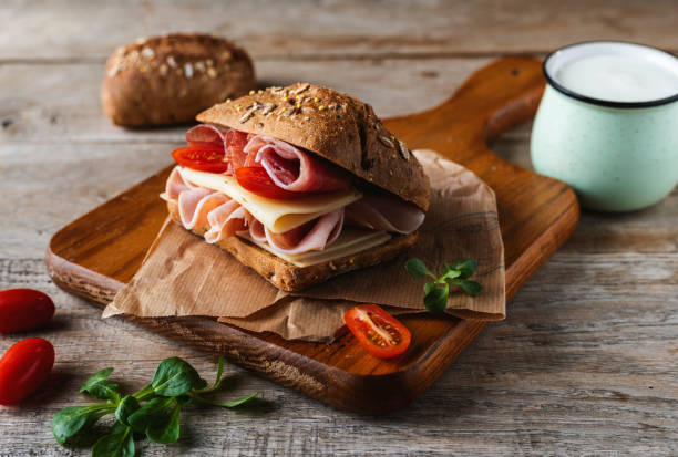 istock A delicious sandwich with ham, prosciutto, cheese and vegetables 1459604994