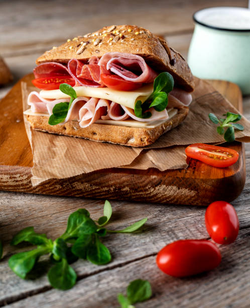 istock A delicious sandwich with ham, prosciutto, cheese and vegetables 1459605008