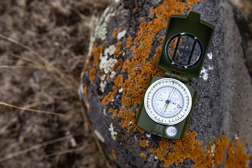 Compass on a stone in a field