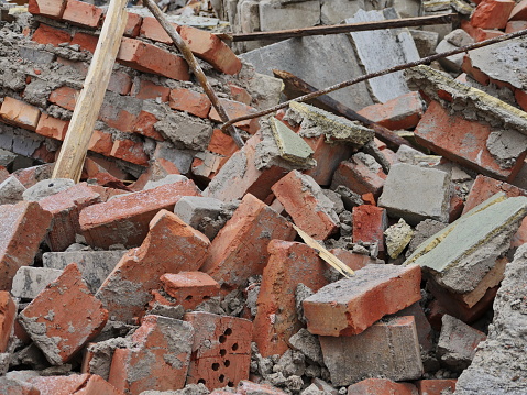 pile of broken red brick