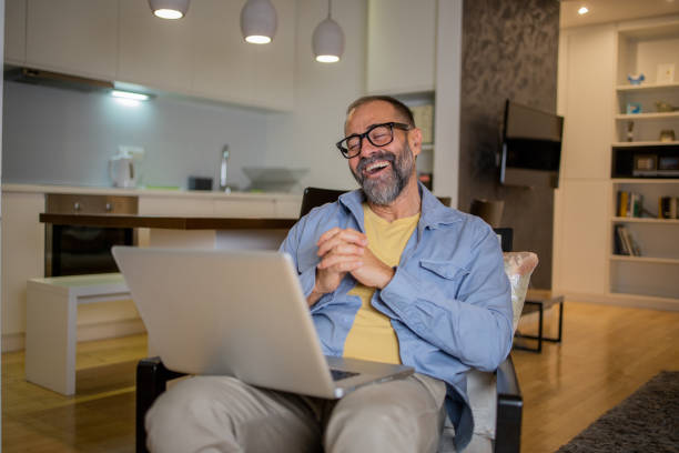 istock Mid adult man working from home 1459617393