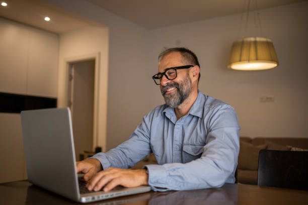istock Mid adult man working from home 1459617454