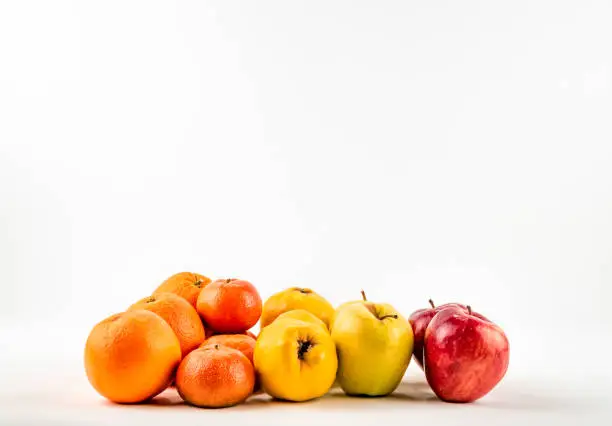 Photo of Fresh ripe mandarin orange apple quince  on white background isolated.