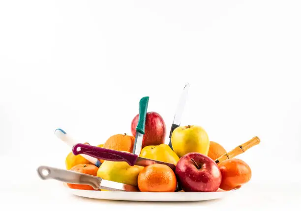 Photo of Fresh ripe fruit bowl on plate white background isolated.