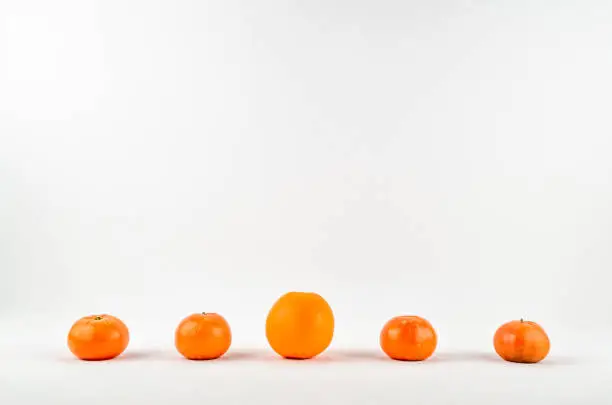 Photo of Fresh ripe mandarin or tangerine and orange on white background isolated.