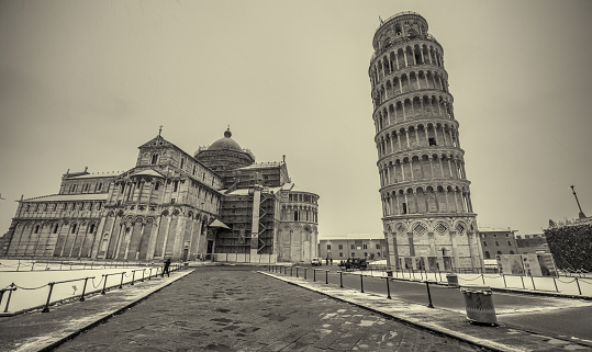 Pisa under the snow. Famous landmarks and monuments of Field of Miracles after a snowstorm.