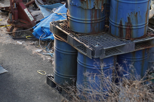 used oil drums. old and rusty and in various colors