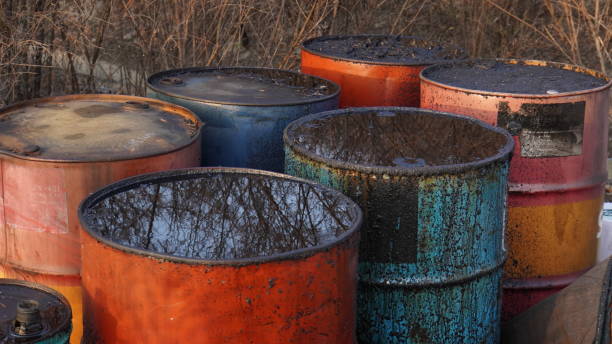 istock used oil drums. old and rusty and in various colors 1459621998