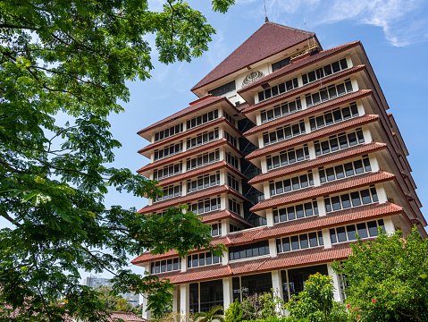 Depok, West Java, Indonesia - August 12, 2022: Bottom perspective of the Center for Administration Building of the University of Indonesia.