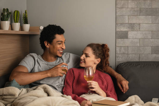 istock Couple drink wine at home 1459630996