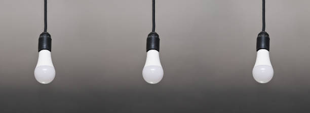 istock three 3 led lamps hang on wires. 1459631005