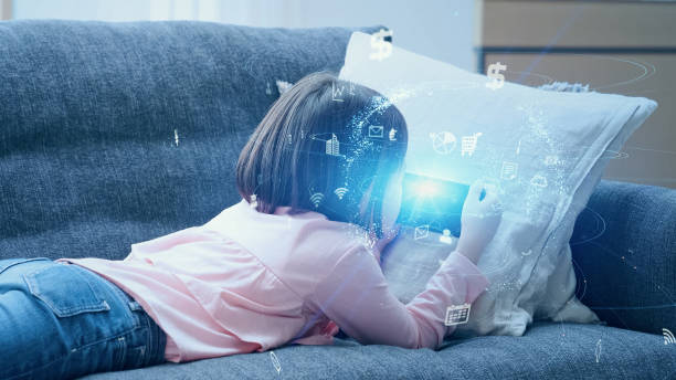 istock Little girl playing with a smart phone. Communication network. 1459640791