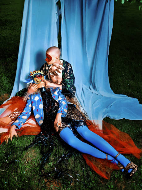 Two young women resting in the meadow.