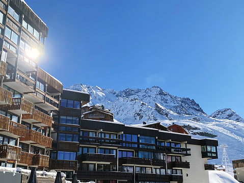 hotel on background of snow mountains in ski resort