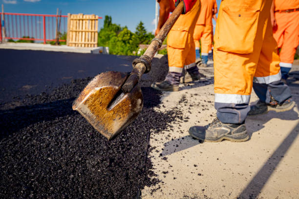 istock Workers are using shovels for realign hot asphalt to correct measure 1459651023