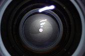 Camera lens with light and lens flare, close-up
