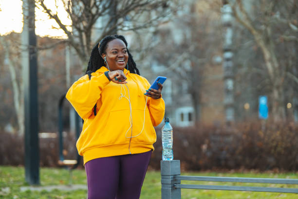 istock Sportswoman checking pulse on smart watch during workout 1459654010