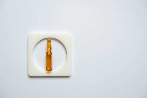 One ampoule is brown, enclosed in a square frame One ampoule is brown, enclosed in a square frame, with a white back. wegovy stock pictures, royalty-free photos & images