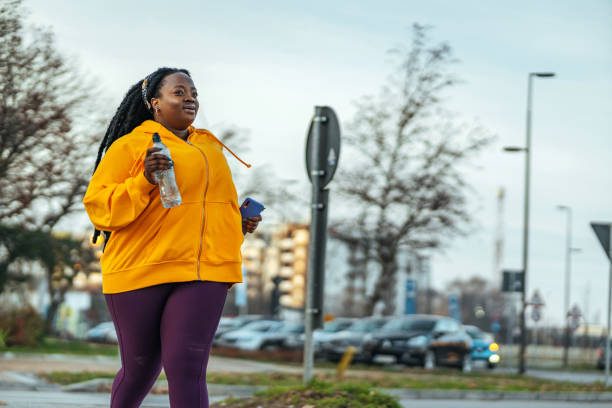 istock Young woman running outside 1459656870