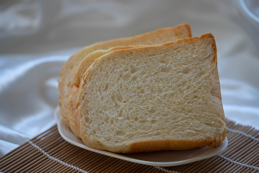 loaf of french bread with near some small pieces of it