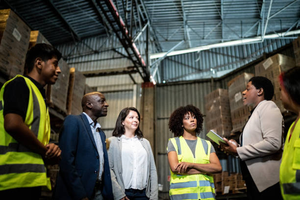 istock Coworkers in a meeting in a warehouse 1459657569