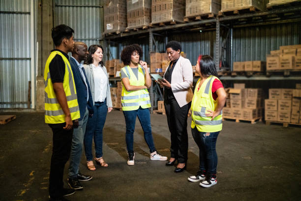 istock Coworkers in a meeting in a warehouse 1459657574