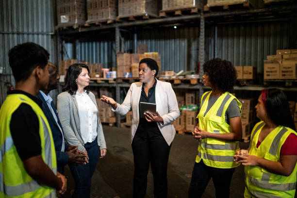 istock Coworkers in a meeting in a warehouse 1459657666