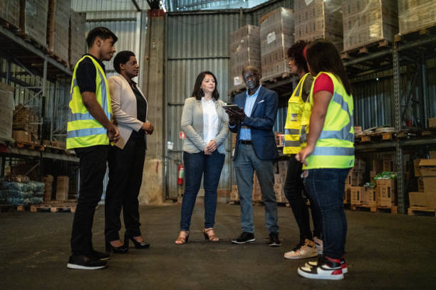 istock Coworkers in a meeting in a warehouse 1459657982