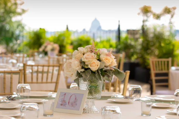 istock Wedding reception or other outdoor festive event. Luxury wedding reception dining table and gold decoration on a table. Table set for a party event or wedding reception. 1459659056