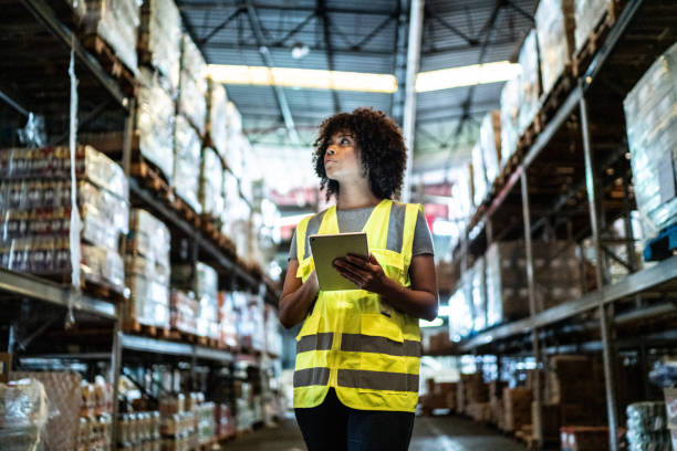 istock Young woman using the digital tablet in a warehouse 1459660632