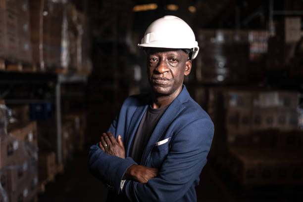 Portrait of a mature man using the digital tablet in a warehouse