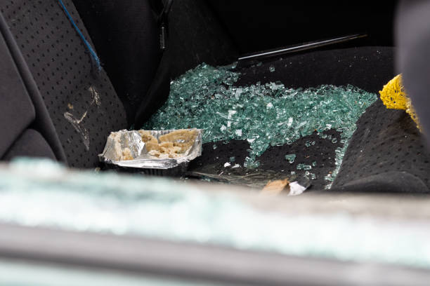 istock Criminal incident. Car hack. Broken left side window of car. 1459663219