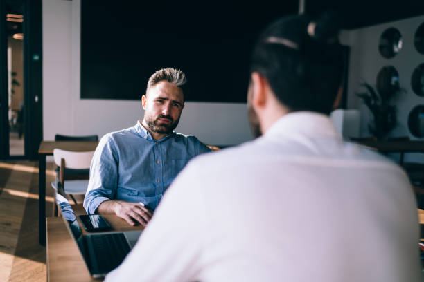 istock Business man in formal shirt at meeting 1459664849