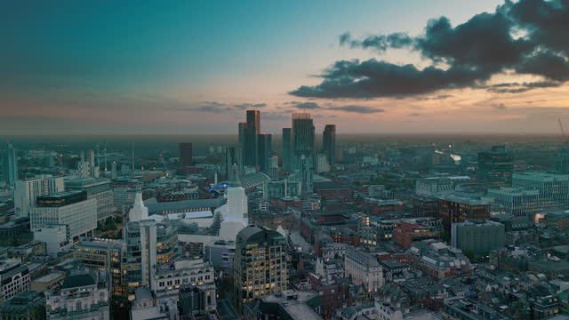 Aerial view Real of Manchester City Office Building in downtown district at sunset time