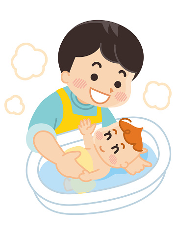 Father is taking a baby in the bath