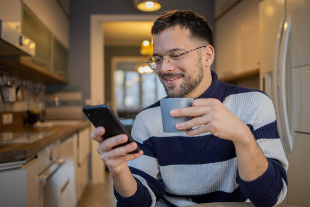 istock Portrait of a young man using smartphone 1459666610