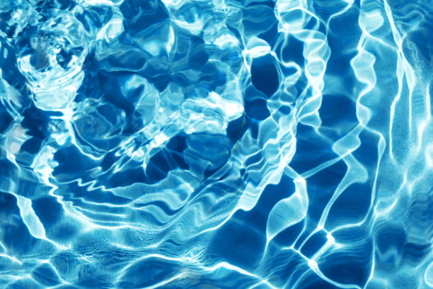istock Waves on the blue water in sunlight 1459675066