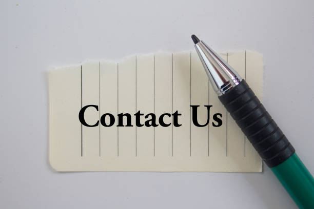 istock Contact Us word written on torn paper 1459675676