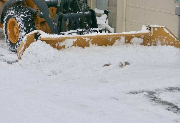 istock Articulated Yellow Tractor Blade - Plowing snow 1459681972