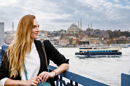Woman travel in Istanbul near Hagia Sophia famous islamic Landmark mosque, Travel to Istanbul, Turkey background