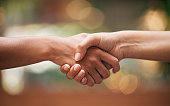 Handshake, closeup and partnership for contract, agreement and teamwork. Trust, support and shaking hands for b2b communication, collaboration and thank you for cooperation, well done and solidarity.