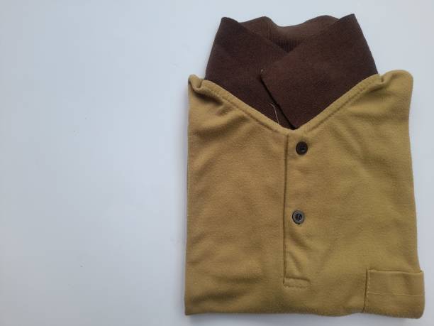 istock brown cotton polo shirt top view on white background. 1459686548