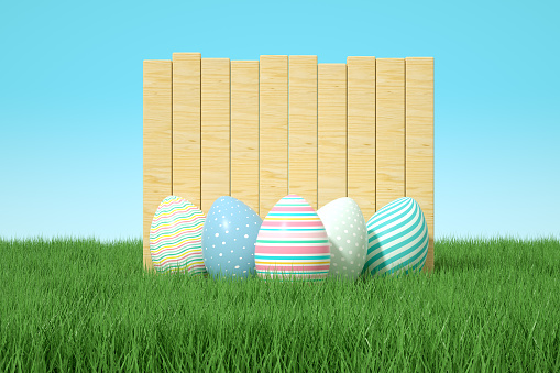 Easter eggs on grass field with empty wooden signboard, 3d render.