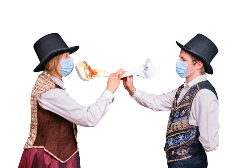 Actors in medical masks and a plague doctor on their face, isolated on a white background